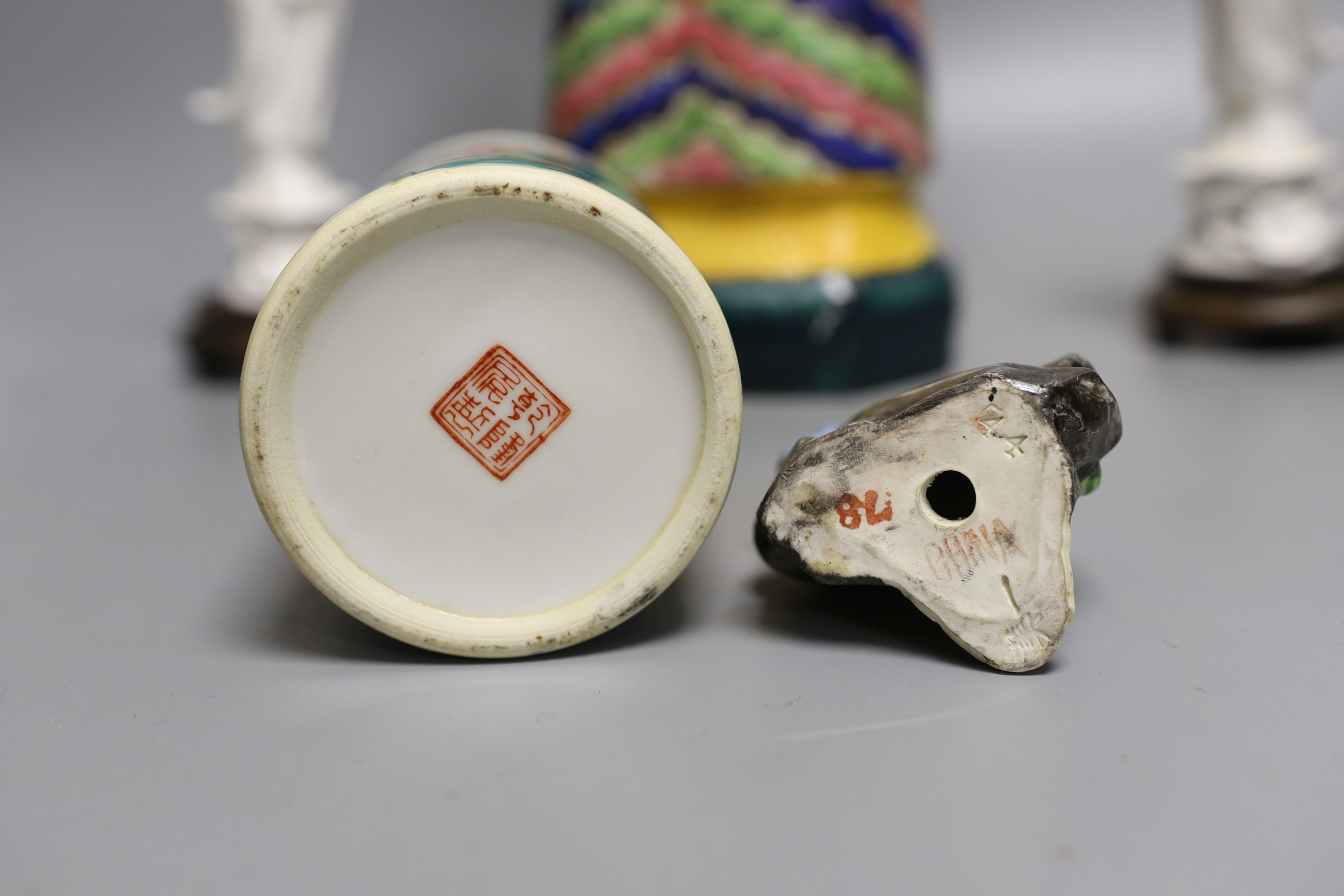 A Chinese brush pot, a pair of blanc de chine deities, a famille rose early 20th century figure, and a Kangxi emperor brush holder (5) - 45cm tall